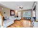 Bright living room with hardwood floors, a cozy sectional sofa and front door at 4539 Lyndenwood Cir, Highlands Ranch, CO 80130