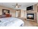 Comfortable main bedroom with a fireplace and ample closet space at 4539 Lyndenwood Cir, Highlands Ranch, CO 80130