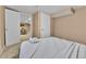 A cozy bedroom features neutral tones, soft carpet, and a comfortable bed with plush bedding at 611 Winona Ct, Denver, CO 80204