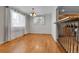 Bright dining area featuring wood floors and contemporary lighting fixtures at 611 Winona Ct, Denver, CO 80204