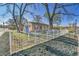 Property with a well-maintained lawn, showcasing curb appeal and a white picket fence at 611 Winona Ct, Denver, CO 80204