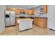Modern kitchen features stainless steel appliances, a tile backsplash, and a central island at 611 Winona Ct, Denver, CO 80204