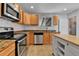 Well-appointed kitchen with stainless steel appliances, granite countertops, and ample cabinet space at 611 Winona Ct, Denver, CO 80204