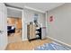 A kitchenette featuring a mini fridge, cabinet, and kitchen accessories at 611 Winona Ct, Denver, CO 80204