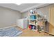 A functional laundry room features a washer, dryer, utility sink, and organized shelving at 611 Winona Ct, Denver, CO 80204
