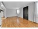 Open-concept living room featuring wood floors and abundant natural light at 611 Winona Ct, Denver, CO 80204