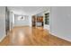 Spacious living area featuring wood floors, leading into kitchen and dining areas at 611 Winona Ct, Denver, CO 80204
