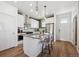 Bright kitchen with a modern island, stainless steel appliances, and contemporary finishes at 924 Andrews Crest Dr, Berthoud, CO 80513