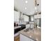 Bright, modern kitchen featuring stainless steel appliances, white cabinets and a center island at 924 Andrews Crest Dr, Berthoud, CO 80513