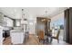 Open-concept living space featuring a kitchen, dining area and living room at 924 Andrews Crest Dr, Berthoud, CO 80513