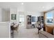 Bright loft area offers versatile space for a home office or play area, featuring large windows at 924 Andrews Crest Dr, Berthoud, CO 80513