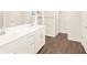 Bright bathroom featuring a double sink vanity with stainless steel fixtures at 1935 Coolidge Way, Aurora, CO 80018