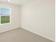 Bright bedroom with a large window providing natural light and view to the outside at 1935 Coolidge Way, Aurora, CO 80018