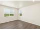 Bedroom with two large windows provides lots of natural light and wood-look floors at 1935 Coolidge Way, Aurora, CO 80018