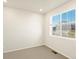 Bedroom featuring a large window providing natural light and view of the exterior at 1935 Coolidge Way, Aurora, CO 80018