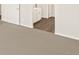 Carpeted flooring throughout bedroom and hardwood flooring in bathroom at 1935 Coolidge Way, Aurora, CO 80018