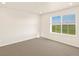 Clean bedroom with carpet flooring and a window at 1935 Coolidge Way, Aurora, CO 80018