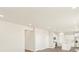 Bright, open-concept kitchen features white cabinetry, stainless steel appliances, and a center island at 1935 Coolidge Way, Aurora, CO 80018