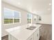 Spacious living room features a large window with bright natural light and wood-look floors at 1935 Coolidge Way, Aurora, CO 80018