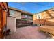 Brick building overlooks backyard area with wood deck and stone patio at 241 N Grant St, Denver, CO 80203