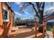 Wooden deck provides backyard view with seating area and mature tree at 241 N Grant St, Denver, CO 80203