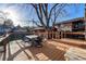 A wooden deck with outdoor table and chairs overlooks backyard area at 241 N Grant St, Denver, CO 80203