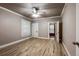 Bedroom with hardwood floors, a ceiling fan and bright windows at 241 N Grant St, Denver, CO 80203