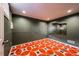 A bedroom featuring a retro orange carpet, dark green walls, and modern recessed lighting at 241 N Grant St, Denver, CO 80203