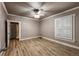 Bedroom with hardwood floors, a ceiling fan and bright windows at 241 N Grant St, Denver, CO 80203
