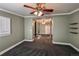 Carpeted bedroom offers crown molding, shelves and bright windows at 241 N Grant St, Denver, CO 80203