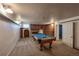 A game room featuring a pool table, carpeted floors and a brick facade at 241 N Grant St, Denver, CO 80203