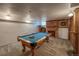 A game room featuring a pool table, carpeted floors and a brick facade at 241 N Grant St, Denver, CO 80203