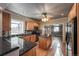 Well-lit kitchen featuring granite countertops, an island, and stainless steel appliances at 241 N Grant St, Denver, CO 80203