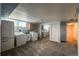 A laundry room featuring a sink, washer, dryer, full sized fridge and carpeted floors at 241 N Grant St, Denver, CO 80203