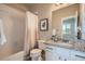 Full bathroom featuring a shower-tub combo and vanity with granite countertop at 15530 W 64Th Pl # C, Arvada, CO 80007