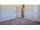 Carpeted bedroom with access to a bathroom and walk-in closet at 15530 W 64Th Pl # C, Arvada, CO 80007