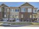 Beautiful two-story townhome with brick accents and well-maintained landscaping at 15530 W 64Th Pl # C, Arvada, CO 80007