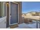Welcoming front entrance with a brick facade and a doormat that says, 