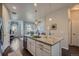 Eat-in kitchen island faces living room, providing an open floor plan and tons of natural light at 15530 W 64Th Pl # C, Arvada, CO 80007