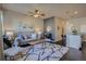 Comfortable living room open to the kitchen with a large rug and modern decor at 15530 W 64Th Pl # C, Arvada, CO 80007