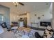 Open concept living room view showcases modern furniture, an eat-in kitchen, and hardwood floors at 15530 W 64Th Pl # C, Arvada, CO 80007