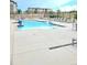 Sparkling community pool with lounge chairs, tables, and wheelchair access at 15530 W 64Th Pl # C, Arvada, CO 80007