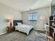 A bedroom featuring a comfortable bed, ample natural light, and views of the outdoors at 607 Azalea St, Brighton, CO 80601
