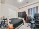 Bedroom featuring carpeted floors, a closet, and a window letting in natural light at 607 Azalea St, Brighton, CO 80601