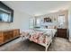 Bright bedroom with twin beds, large windows, and plenty of natural light at 607 Azalea St, Brighton, CO 80601