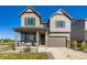 Charming two-story home with a covered front porch and attached two-car garage in a desirable neighborhood at 607 Azalea St, Brighton, CO 80601