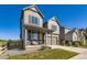 Beautiful two-story home with a well-maintained lawn and attached garage on a sunny day at 607 Azalea St, Brighton, CO 80601