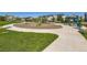 Community playground with various play structures, surrounded by green grass and walking paths at 607 Azalea St, Brighton, CO 80601