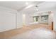 Open basement space with recessed lighting and a sliding door to outside at 11237 W Ford Dr, Lakewood, CO 80226