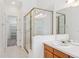 Bathroom featuring a walk in shower and ample storage at 11237 W Ford Dr, Lakewood, CO 80226